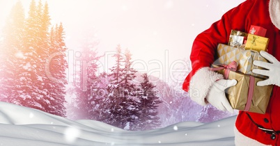 Santa holding gifts in Christmas Winter landscape