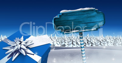 GIft and Wooden signpost in Christmas Winter landscape