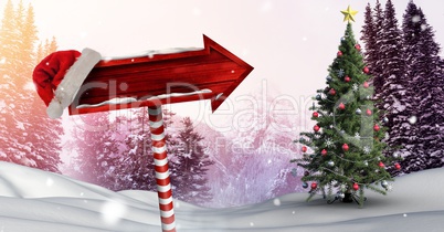 Wooden signpost in Christmas Winter landscape and Santa hat with Christmas tree