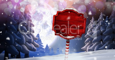 Wooden signpost in Christmas Winter landscape