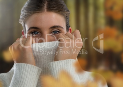 Woman's face in forest with leaves