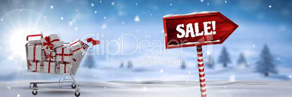 Sale text and gifts in trolley with Wooden signpost in Christmas Winter landscape