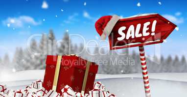 Sale text and gifts with Wooden signpost in Christmas Winter landscape and Santa hat