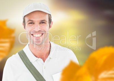 Man wearing cap in forest with leaves