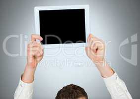 Man holding tablet with grey background