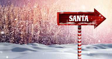 Santa text on Wooden signpost in Christmas Winter landscape