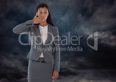 Woman with hand over mouth shocked with dark clouds