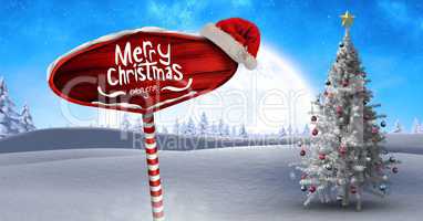 Merry Christmas text on Wooden signpost in Christmas Winter landscape and Santa hat with Christmas t