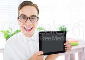 Man holding tablet with bright plants background