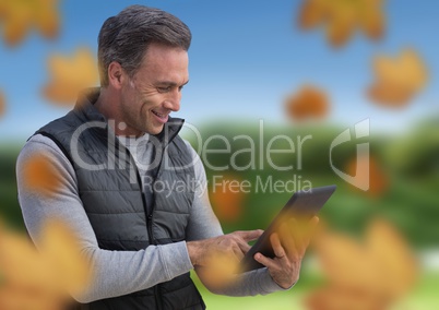 Man in landscape with leaves