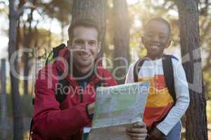 Portrait of teacher and kid reading map