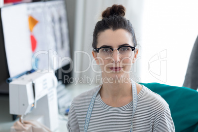 Fashion designer sitting on chair