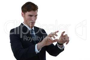 Businessman pretending to use an invisible screen