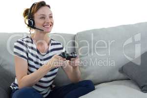 Woman in headphones playing video game