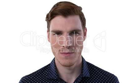 Male executive standing against white background