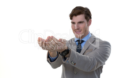 Businessman pretending to hold an invisible object