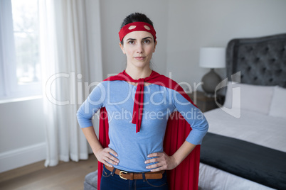 Portrait of beautiful woman pretending to be superhero