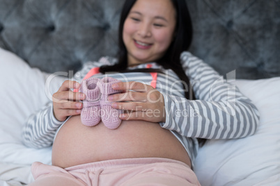 Pregnant woman looking at socks