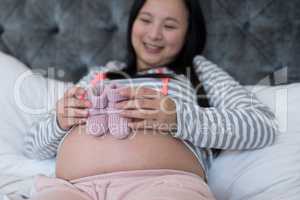 Pregnant woman looking at socks