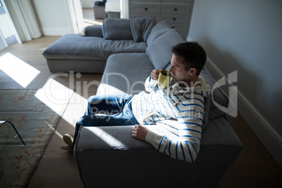 Man having coffee in the living room