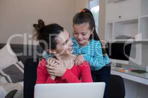 Mother and daughter interacting with each other