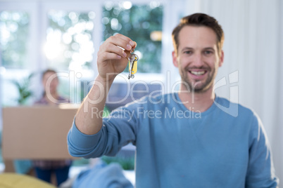 Man showing a key of their new house