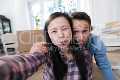 Pregnant couple making facial expression