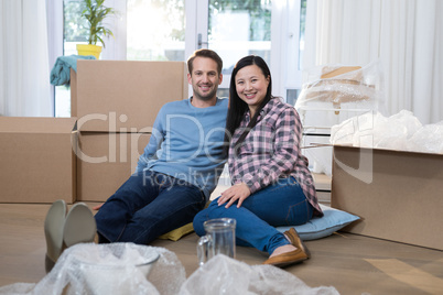 Couple relaxing together at their new home