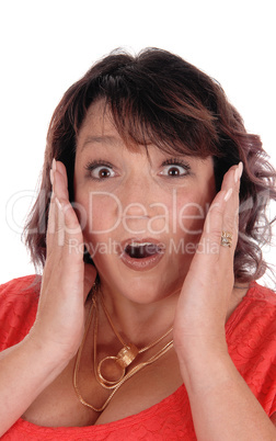 Surprised woman with hands on face