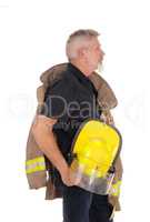 A firefighter standing in profile