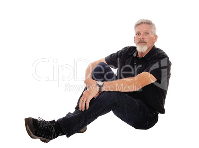Middle age man sitting on floor