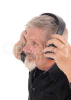 Middle age man listening to music
