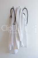 Laboratory coat and stethoscope hanging on hook