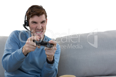 Man playing video game against white background