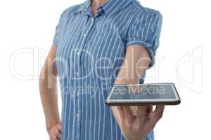 Female executive holing digital tablet