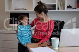 Mother and daughter interacting with each other