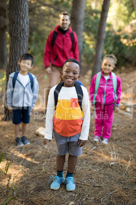 Kids and teacher standing in park