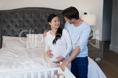 Couple feeling the presence of baby in her stomach