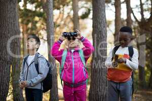Kids looking through binoculars