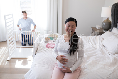 Happy woman feeling the presence of baby in stomach