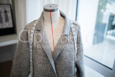 Blazer and measuring tape on mannequin