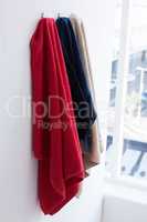 Colorful towels hanging on hook
