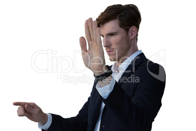 Businessman pretending to use an invisible screen