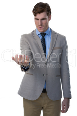 Businessman pretending to hold an invisible object