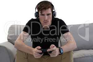 Man playing video game against white background