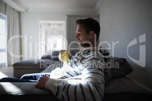 Man having coffee in the living room