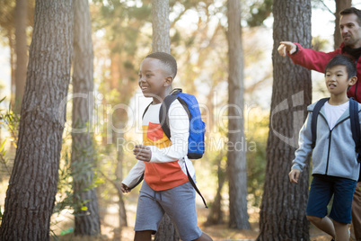 Teacher interacting with kids in park