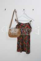 Dress and bag hanging on hook