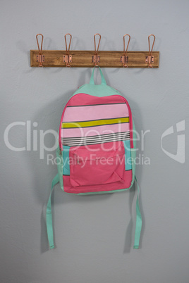 Schoolbags hanging on hook