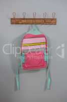 Schoolbags hanging on hook